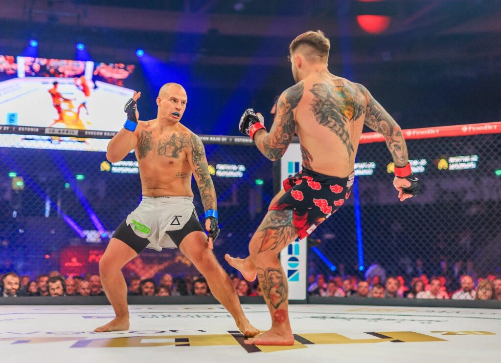 Arturs Leisans, with the Sports Strike TV logo on his shorts, facing Oskar Herczyk at Evecon RAJU 20